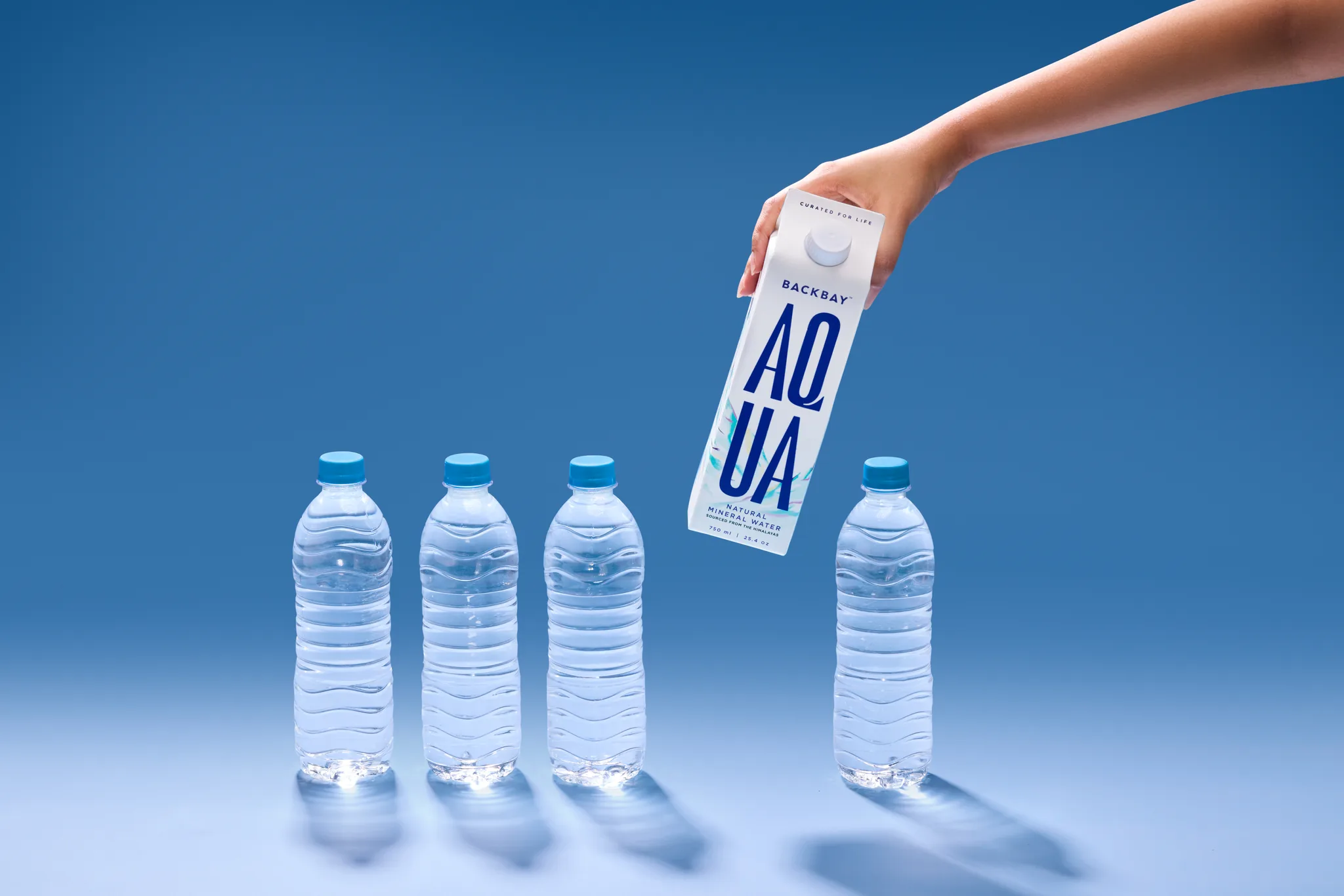 AQUA set down among plastic bottles